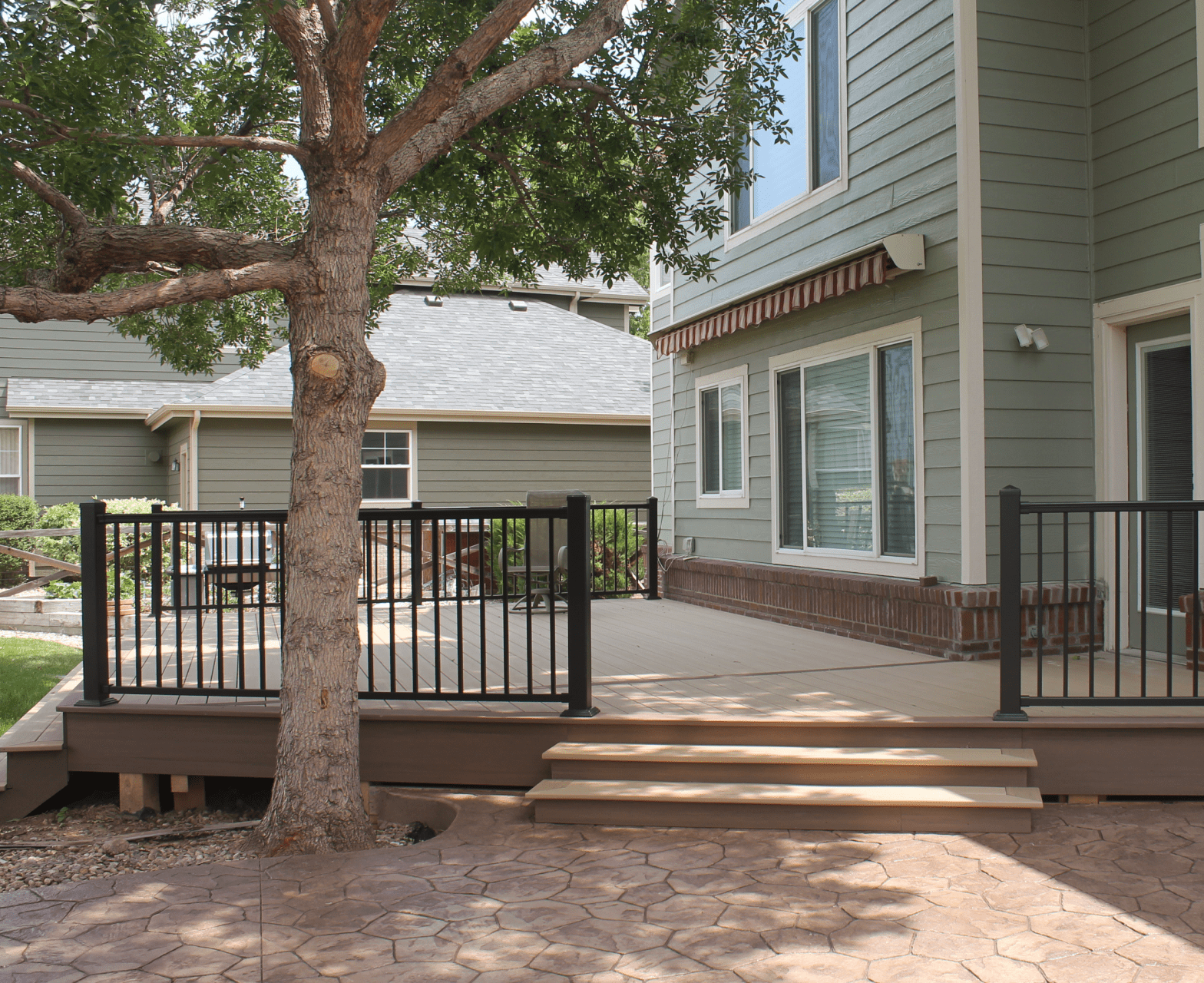 Spacious ground level deck integrated with backyard
