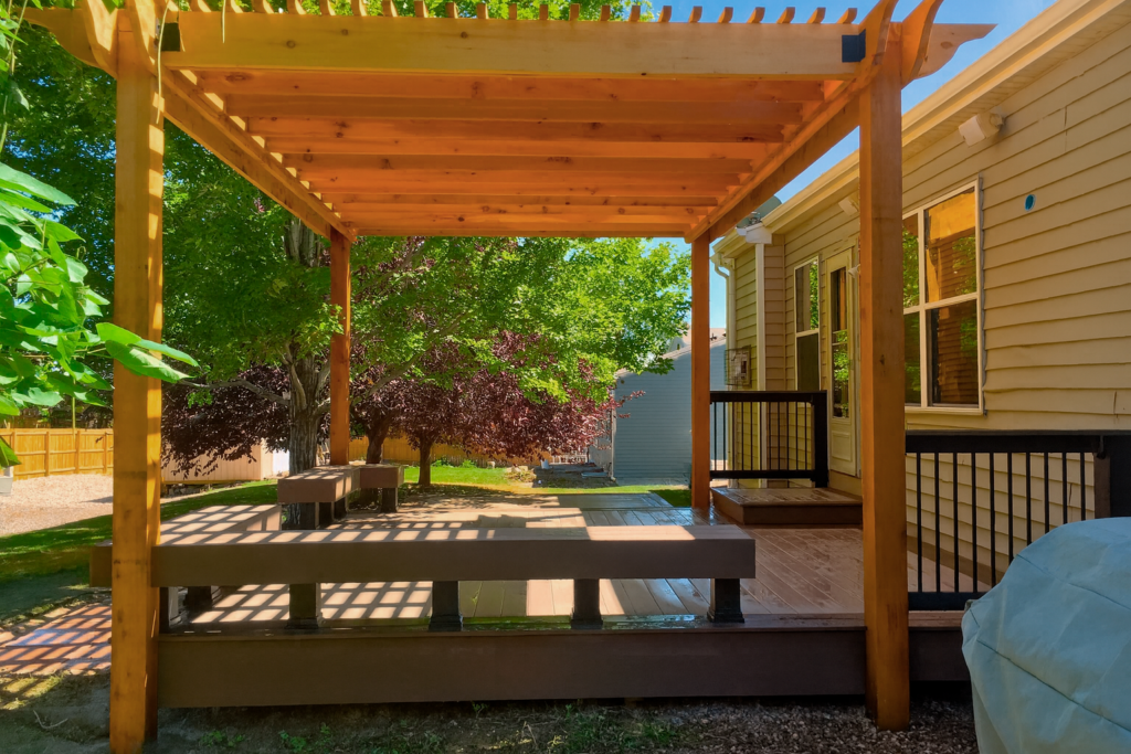 custom deck and pergola integration idea with wooden structure for outdoor living in Colorado