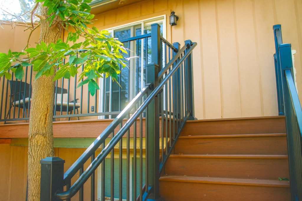 steel vs wood deck building with steel railing and composite wood steps for Colorado outdoor living