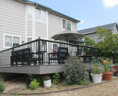 Outdoor deck built for entertaining in Boulder Colorado with open layout and pergola